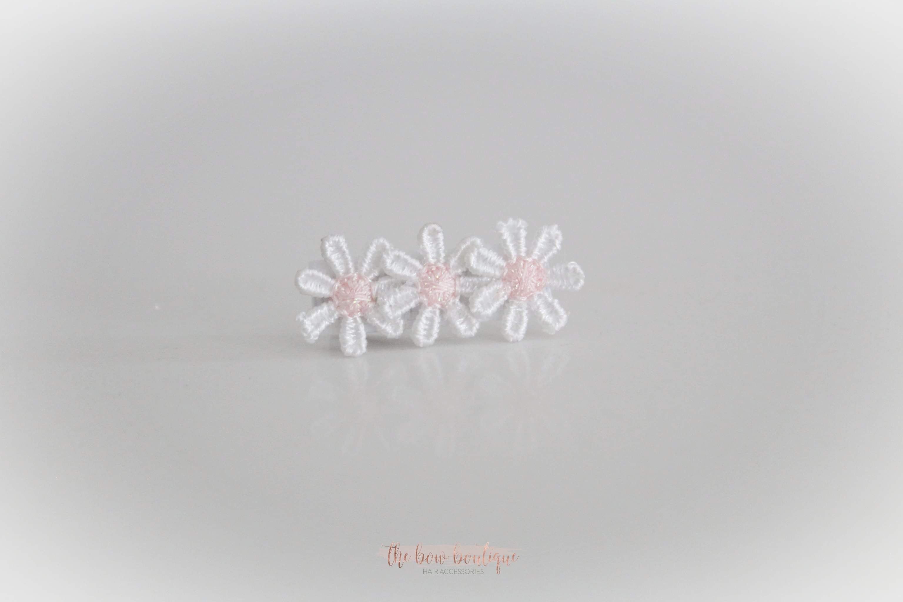 Delicate pink daisy flowers | Clip or headband