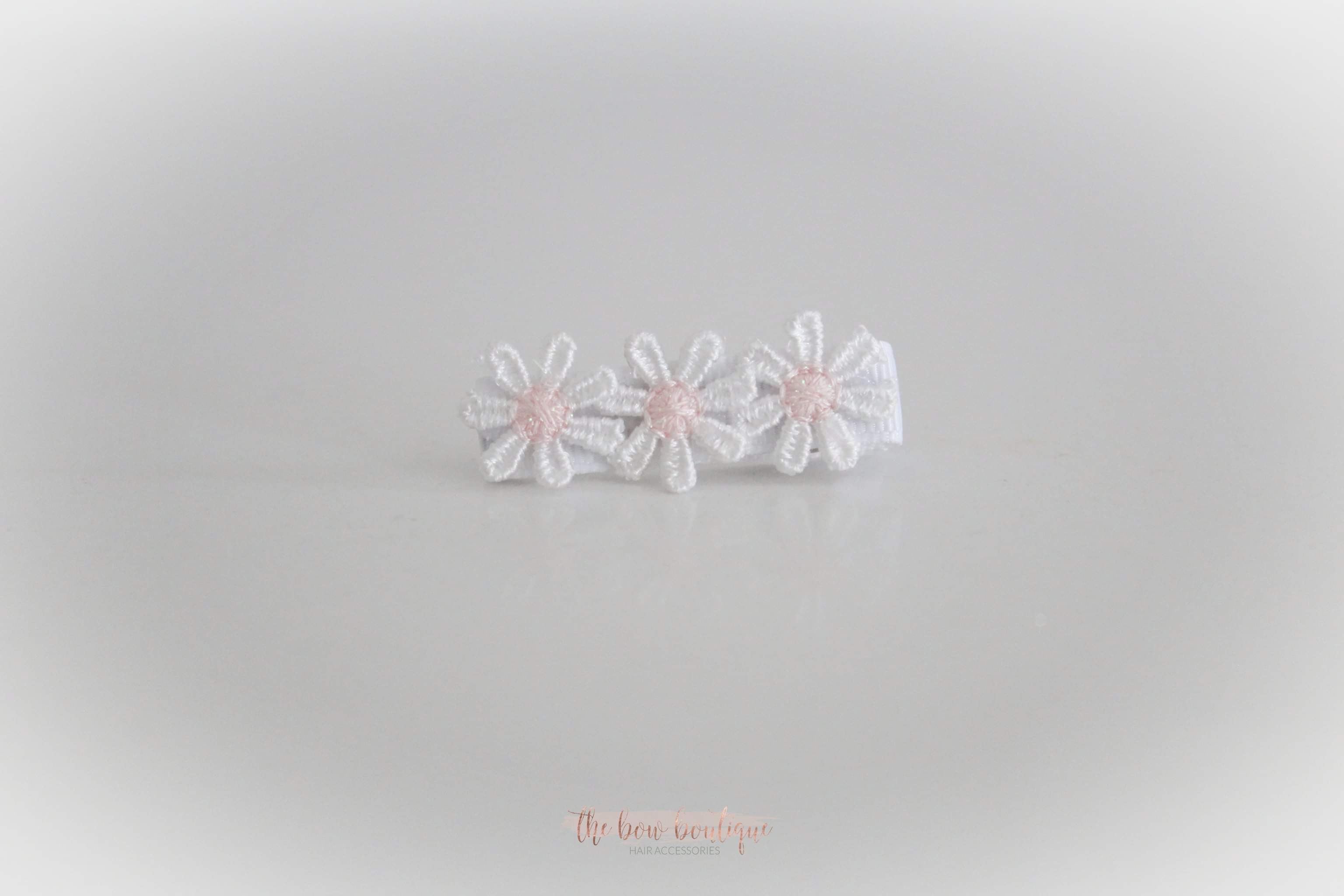 Delicate pink daisy flowers | Clip or headband
